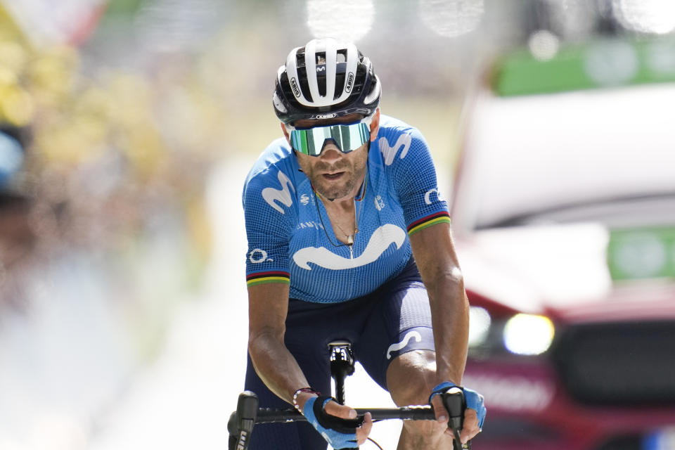 Spain's Alejandro Valverde crosses the finish line in second place during the fifteenth stage of the Tour de France cycling race over 191.3 kilometers (118.9 miles) with start in Ceret and finish in Andorra-la-Vella, Andorra, Sunday, July 11, 2021. (AP Photo/Christophe Ena)