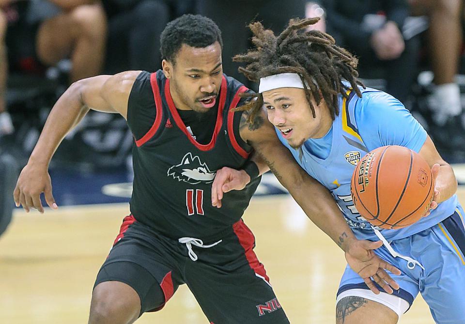 Northern Illinois' David Coit pressures Kent State's Jalen Sullinger as he brings the ball up the court March 9, 2023, in Cleveland.