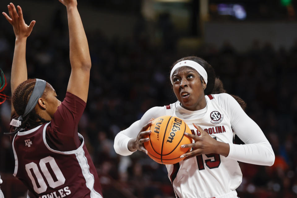 South Carolina forward Laeticia Amihere, right, drives to the basket against Texas A&M guard Sydney Bowles during the first half of an NCAA college basketball game in Columbia, S.C., Thursday, Dec. 29, 2022. (AP Photo/Nell Redmond)