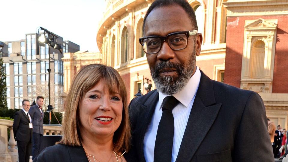 Lisa Makin in a black dress with Lenny Henry in a suit