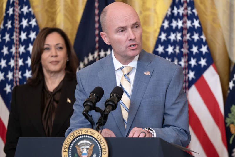Gov. Spencer Cox, R-Utah, and chairman of the National Governors Association, delivers remarks as Vice President Kamala Harris (L) looks on during the National Governors Association Winter Meeting the White House Friday. Photo by Leigh Vogel/UPI