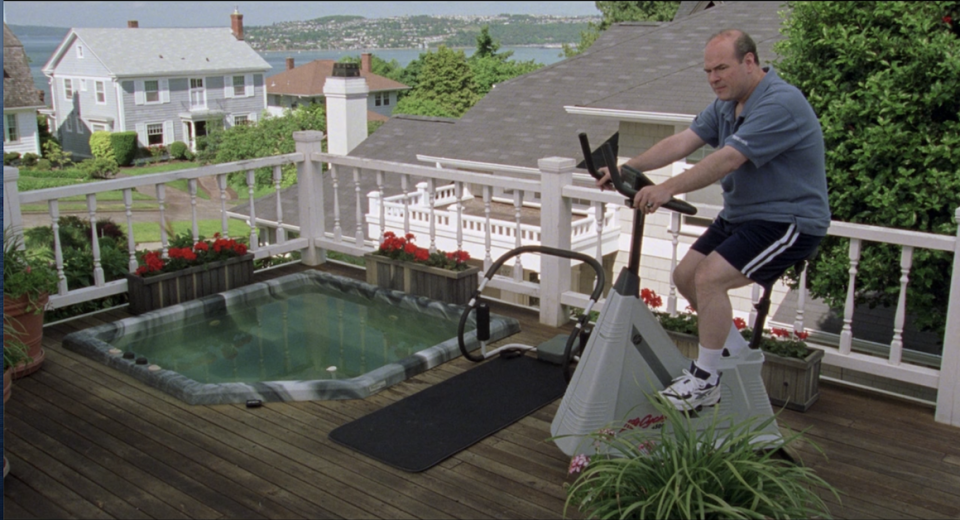 Mr. Stratford exercising on the porch, next to the hot tub