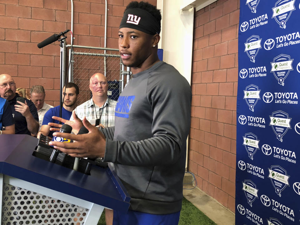 New York Giants NFL football player Saquon Barkley speaks to the media in East Rutherford, N.J., Monday, Aug. 6, 2018. (AP Photo/Tom Canavan)