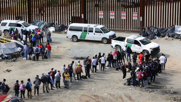 PHOTO: Migrants gather between the primary and secondary border fences in San Diego as the United States prepares to lift COVID-19-era restrictions known as Title 42 as seen from Tijuana, Mexico, May 8, 2023. (Jorge Duenes/Reuters, FILE)