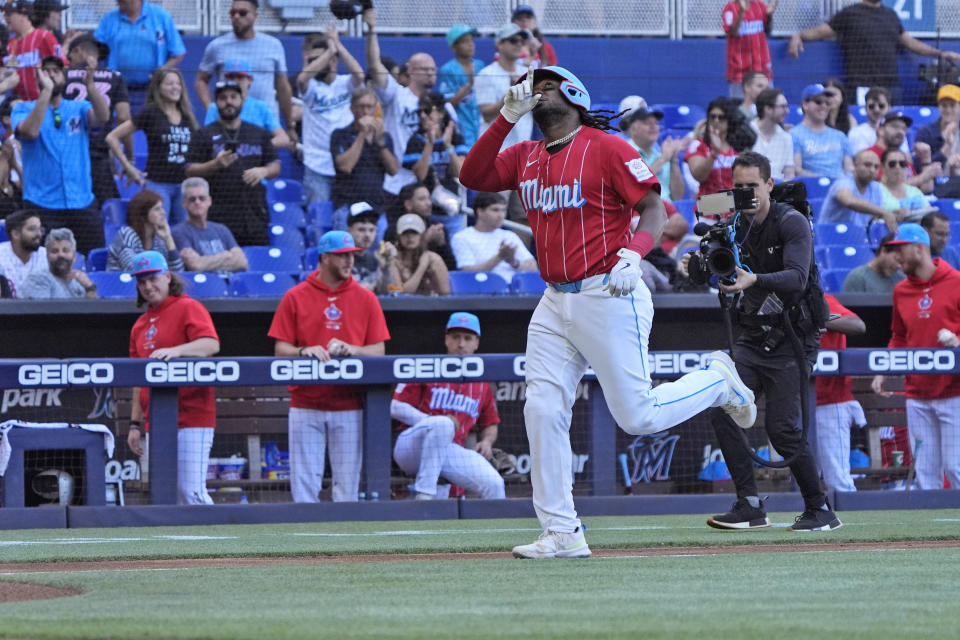 Miami Marlins' Josh Bell celebrates as he heads to home plate after hitting a home run during the first inning of a baseball game against the Atlanta Braves, Saturday, April 13, 2024, in Miami. (AP Photo/Wilfredo Lee)