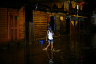 <p>A woman walks through a flooded street as Hurricane Irma moves off from the northern coast of the Dominican Republic, in Puerto Plata, Dominican Republic, Sept. 7, 2017. (Photo: Ivan Alvarado/Reuters) </p>