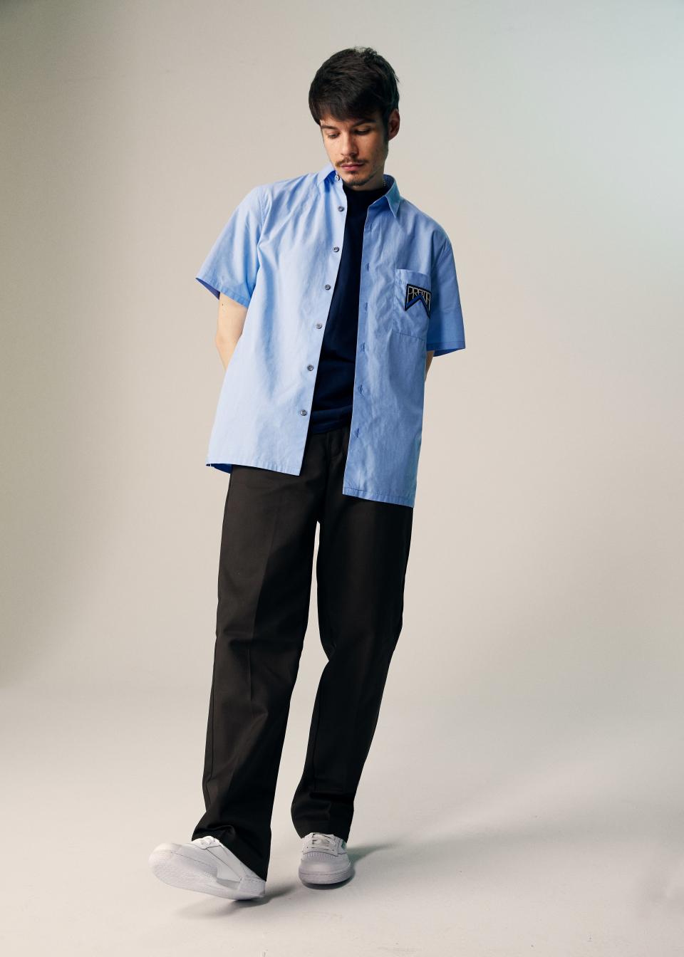 <cite class="credit">Tee by Ben Davis / Shirt by Prada / Pants by Dickies / Shoes by Reebok</cite>