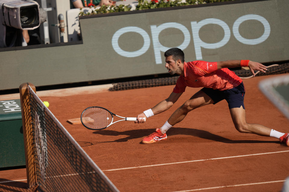 Serbia's Novak Djokovic plays a shot against Russia's Karen Khachanov during their quarterfinal match of the French Open tennis tournament at the Roland Garros stadium in Paris, Tuesday, June 6, 2023. (AP Photo/Thibault Camus)