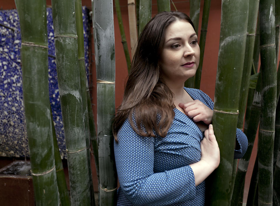 In this March 1, 2012 photo, rape survivor Helena Lazaro poses for a photo in Glendale, Calif. For seven years, Lazaro believed the man who had violated not just her body at knifepoint, but also her psyche, was free to carry out a threat to kill her and her family if she reported the attack. But, he had been arrested and released, as DNA collected impersonally from the most intimate parts of her body sat untested with thousands of other rape kits in a police storeroom instead of being entered into an FBI database. (AP Photo/Damian Dovarganes)