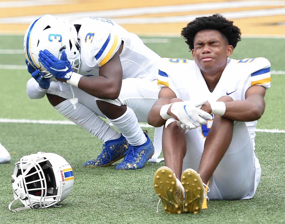 Senatobia's Tra'keriun Bonner (3) and Jagger Young react after the Warriors missed a potential winning field goal against Columbia in the MHSAA Class 4A Football State Championship game at M.M. Roberts Stadium on the University of Southern Mississippi campus in Hattiesburg, Miss., on Saturday, December 4, 2021.