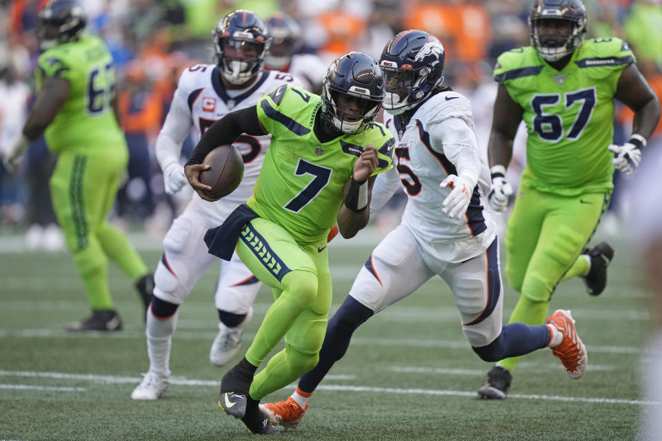 Seattle Seahawks quarterback Geno Smith (7) scrambles against the Denver Broncos during the first half of an NFL football game, Monday, Sept. 12, 2022, in Seattle. (AP Photo/Stephen Brashear)