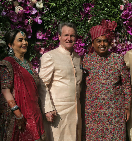 Mukesh Ambani, the Chairman of Reliance Industries, his wife Nita Ambani and Brian T. Moynihan, CEO of the Bank of America Corporation, pose during a photo opportunity at the wedding ceremony of Mukesh's son Akash Ambani at Bandra-Kurla Complex in Mumbai, India, March 9, 2019. REUTERS/Francis Mascarenhas