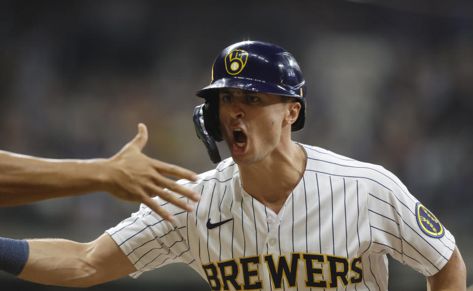 Milwaukee Brewers' Sal Frelick reacts after his run-scoring single during the ninth inning of a baseball game against the Pittsburgh Pirates, Saturday, Aug 5, 2023, in Milwaukee. (AP Photo/Jeffrey Phelps)