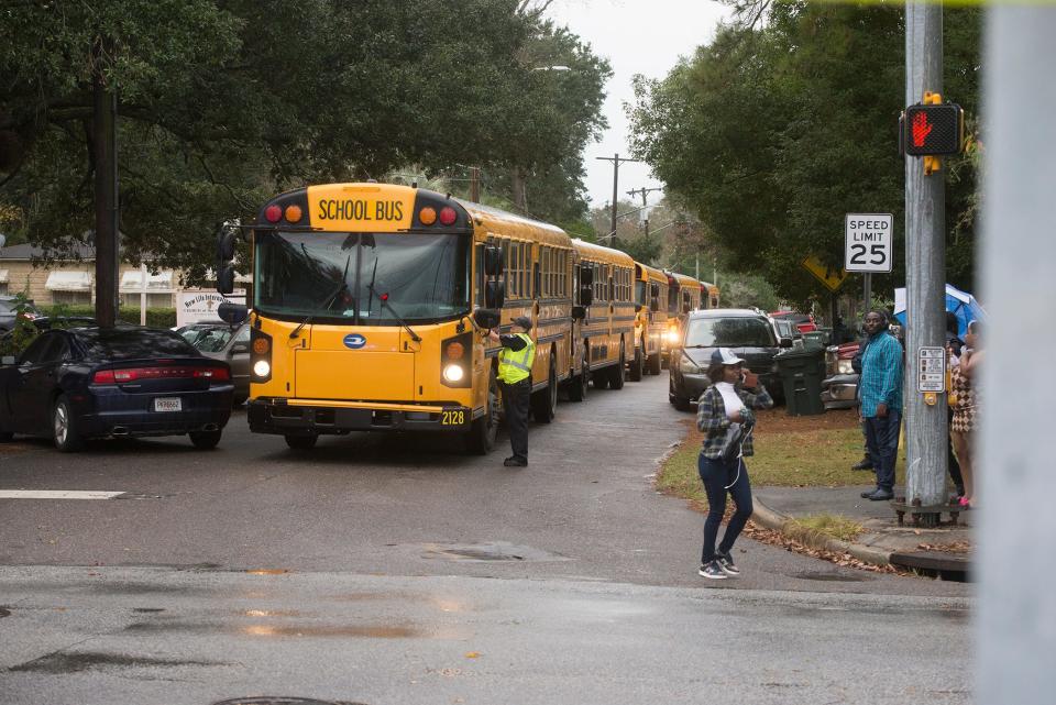Buses line up on Capital Avenue near Savannah High School on Tuesday.
