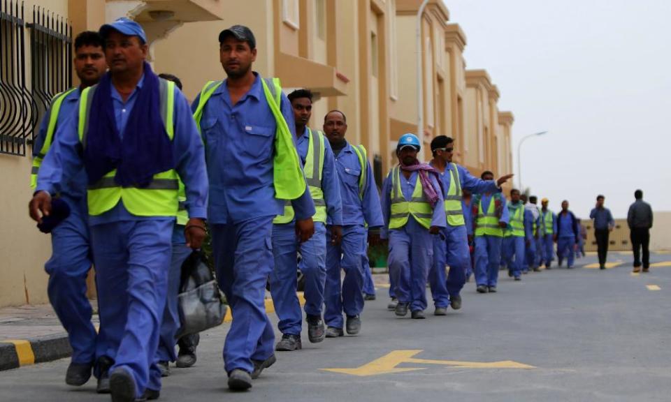 Foreign labourers return to their accommodation in Doha’s Al-Wakrah suburbs.