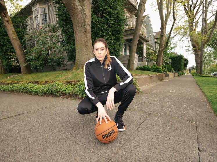 WNBA star Breanna Stewart poses with a Puma basketball.