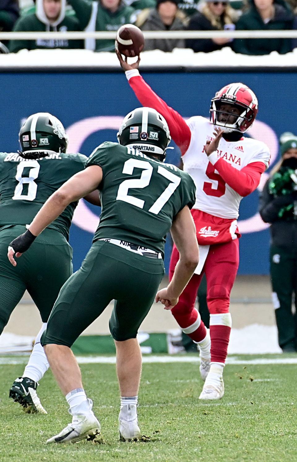 Nov 19, 2022; East Lansing, Michigan, USA;  Indiana Hoosiers quarterback Dexter Williams II (5) throws upfield against the Michigan State Spartans at Spartan Stadium. Mandatory Credit: Dale Young-USA TODAY Sports