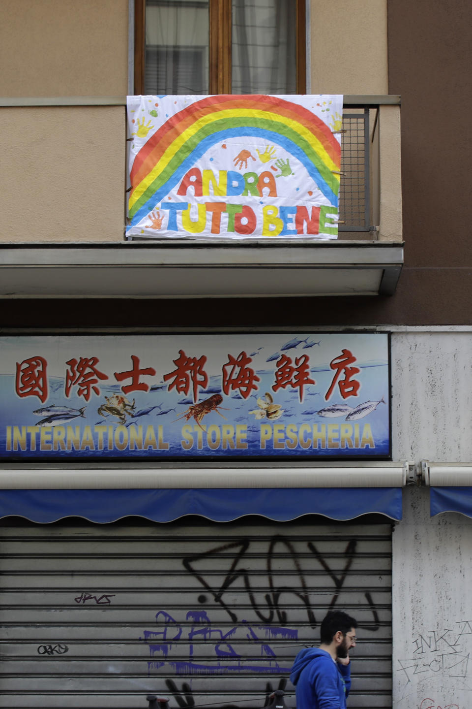 In this photo taken on Friday, March 13, 2020, a banner reading "Everything will be alright" hangs on a balcony in Milan, Italy. The nationwide lockdown to slow coronavirus is still early days for much of Italy, but Italians are already are showing signs of solidarity. This week, children’s drawings of rainbows are appearing all over social media as well as on balconies and windows in major cities ready, ‘’Andra’ tutto bene,’’ Italian for ‘’Everything will be alright.’’ For most people, the new coronavirus causes only mild or moderate symptoms. For some, it can cause more severe illness, especially in older adults and people with existing health problems. (AP Photo/Luca Bruno)