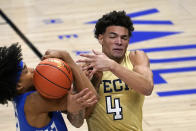 Georgia Tech guard Jordan Usher (4) and Kentucky guard Brandon Boston Jr. (3) battle for the ball during the second half of an NCAA college basketball game Sunday, Dec. 6, 2020, in Atlanta. (AP Photo/John Bazemore)