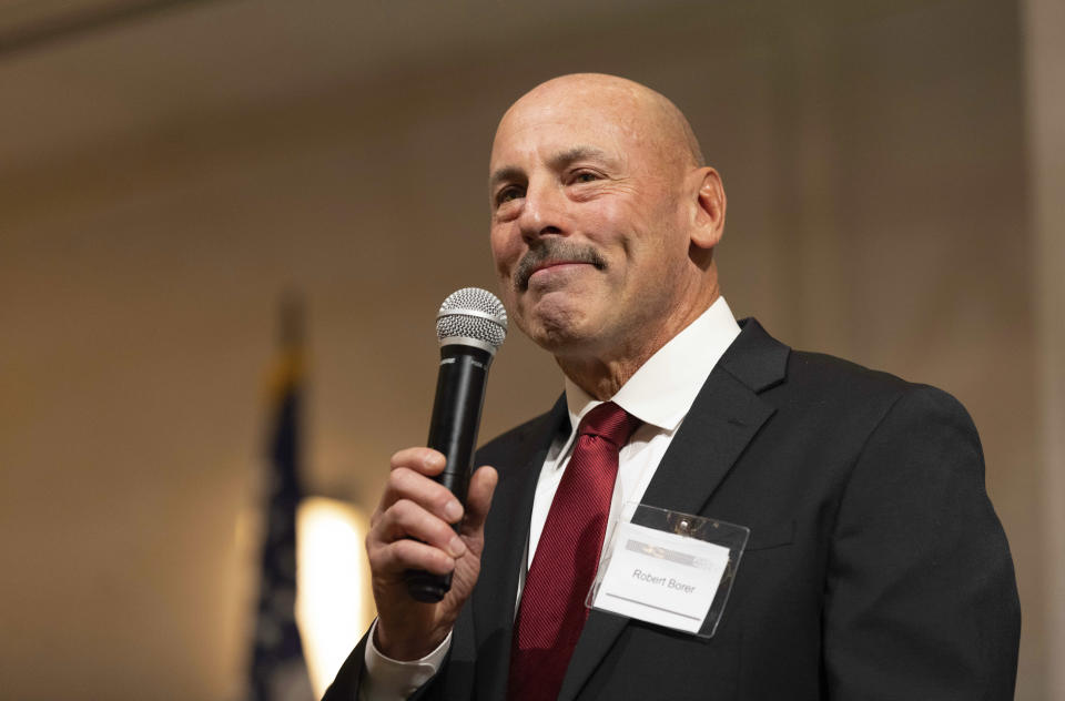 Robert Borer, a write-in candidate for Nebraska governor and host of the Nebraska Election Integrity Forum, delivers welcome remarks to begin the event on Saturday, Aug. 27, 2022, in Omaha, Neb. (AP Photo/Rebecca S. Gratz)