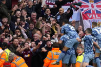 Aston Villa's Ollie Watkins celebrates with team mates after scoring his side's second goal during the English Premier League soccer match between Arsenal and Aston Villa at the Emirates stadium in London, Sunday, April 14, 2024. (AP Photo/Kirsty Wigglesworth)
