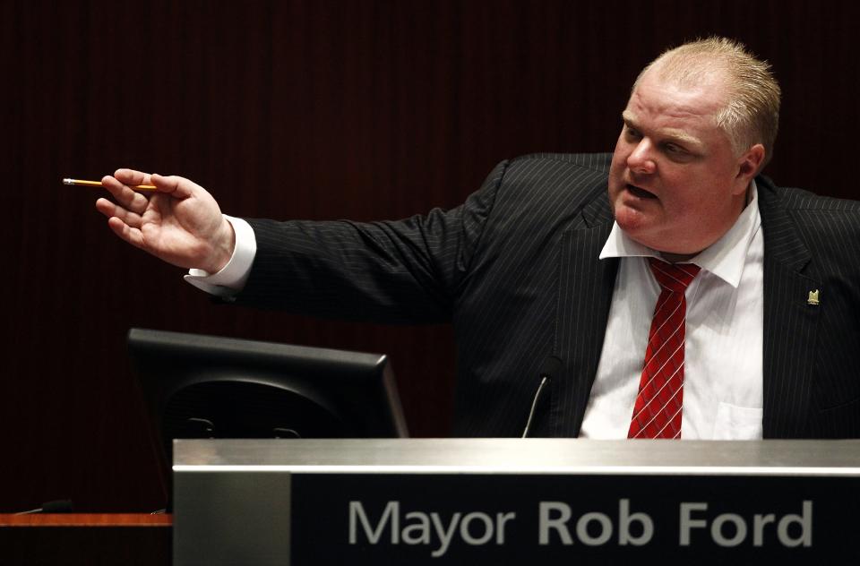 Toronto Mayor Rob Ford attends a special council meeting at City Hall in Toronto November 18, 2013. The Toronto city council may further curb the powers of embattled Mayor Rob Ford on Monday, slashing his office budget and offering his staff a chance to transfer to new jobs. REUTERS/Aaron Harris (CANADA - Tags: POLITICS)