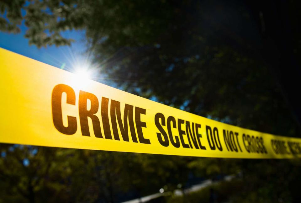 Tetra Images/Getty Images Stock photo of crime scene tape 
