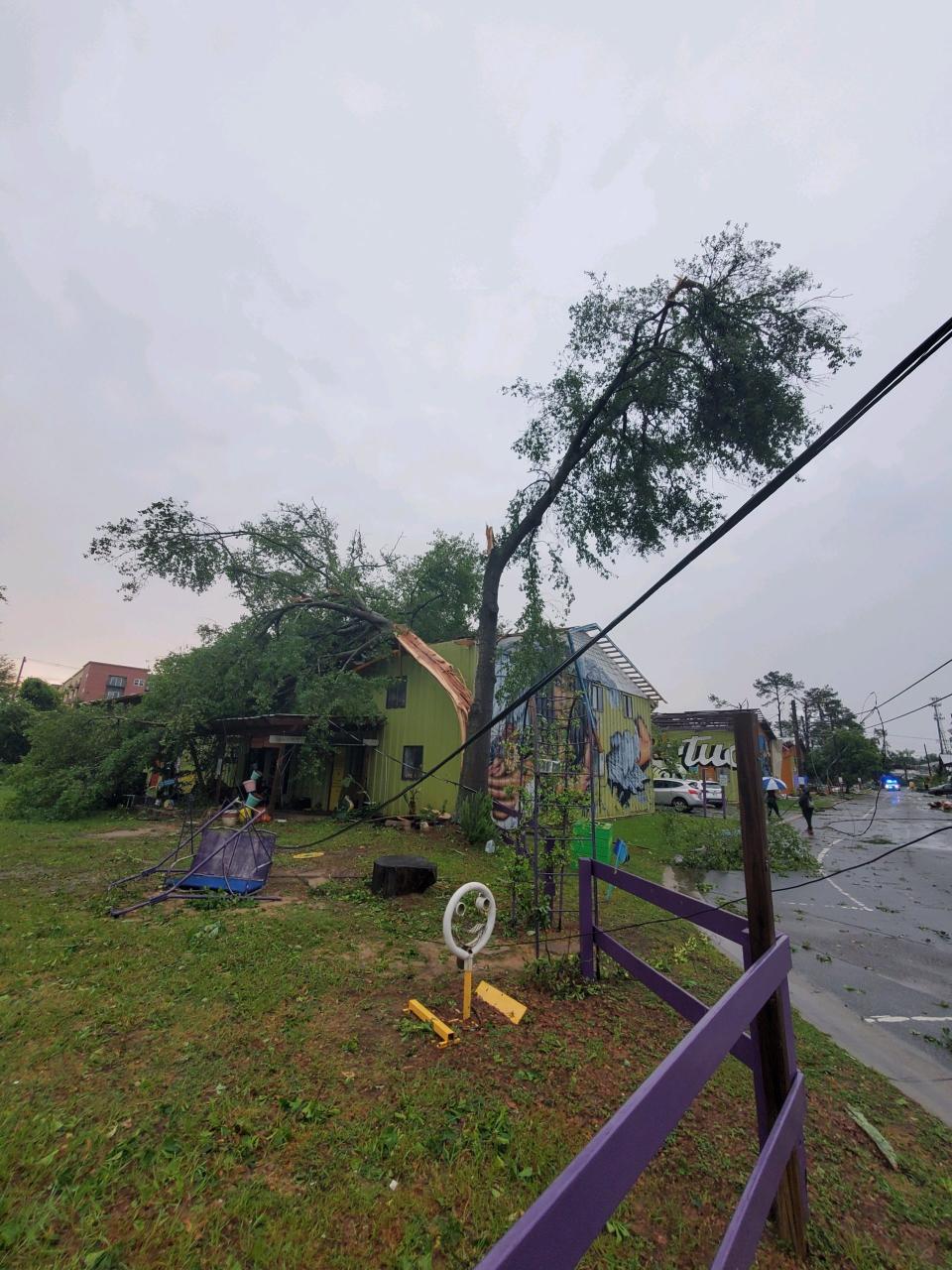 Major damage being seen in the Railroad Square Art District, including split trees and damage to structures.