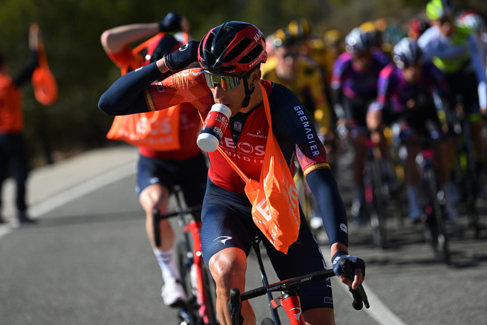 Ineos Grenadiers rider carrying a musette with SiS nutrition and drinking from a water bottle