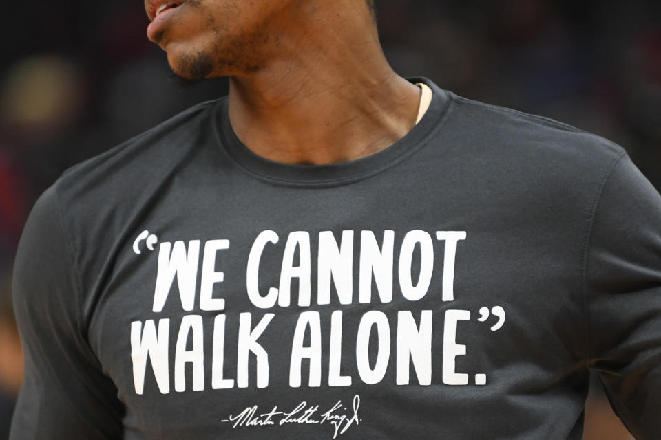 Atlanta Hawks guard Jeff Teague wears a warmup shirt with a quote by Dr. Martin Luther King Jr. before an NBA basketball game against the Toronto Raptors, Monday, Jan. 20, 2020, in Atlanta. (AP Photo/John Amis)