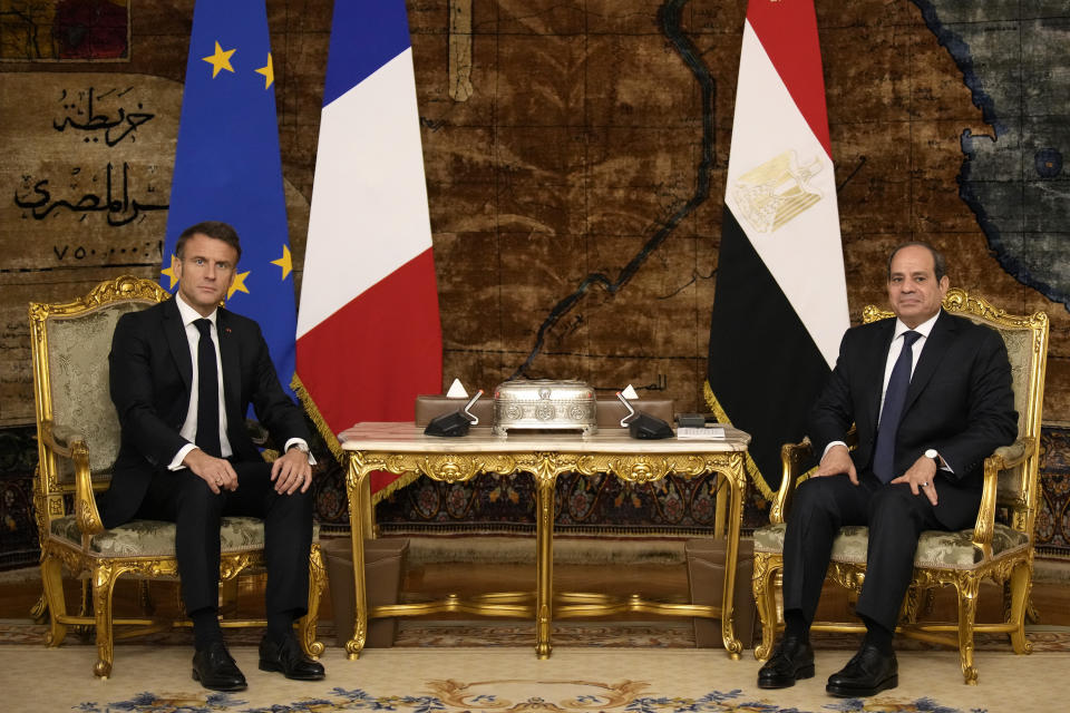Egyptian President Abdel Fattah el-Sissi, right, and French President Emmanuel Macron pose before their talks in Cairo, Egypt, Wednesday, Oct. 25, 2023. French President Emmanuel Macron met Tuesday with Israeli Prime Minister Benjamin Netanyahu in Jerusalem and with Jordan King Abdullah II earlier today in Amman. (AP Photo/Christophe Ena, Pool)