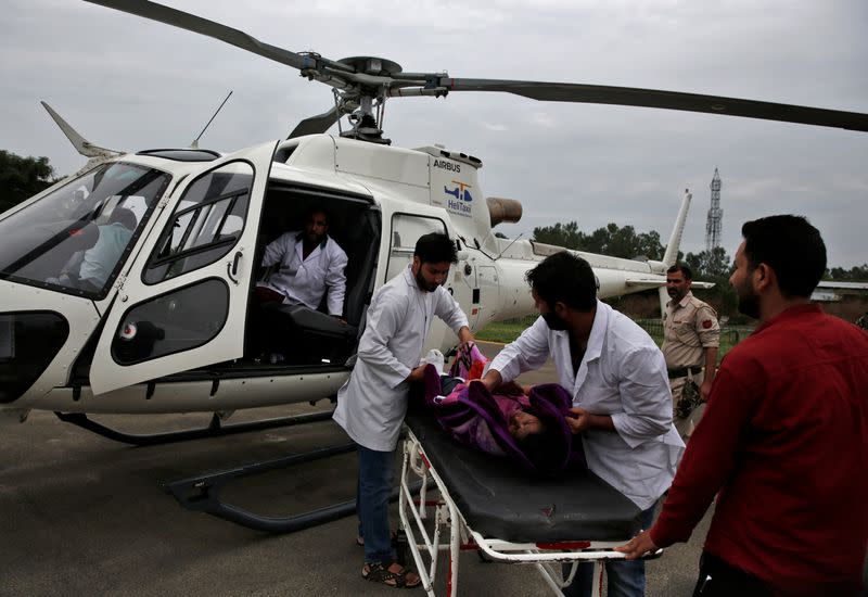 An injured is rushed for treatment at Sher-i-Kashmir Institute of Medical Sciences hospital in Srinagar