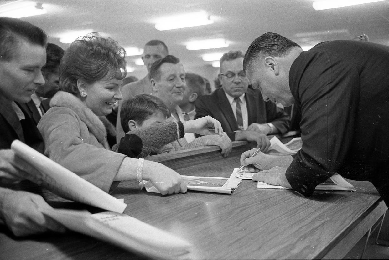 Teamster union President James R. Hoffa signed autographs at a new health center for union members and their families at 6200 W. Blue Mound Rd in Milwaukee on Oct. 4, 1965. He spoke at a ceremony dedicating the clinic, one of several owned and operated by the union. He also gave a press conference at the Pfister Hotel on the strike at the American Motors plant in Kenosha and his support to repeal the "right to work" section of the Taft-Hartley Act.