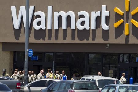 Metro Police officers are shown outside a Walmart after a shooting in Las Vegas June 8, 2014. REUTERS/Las Vegas Sun/Steve Marcus