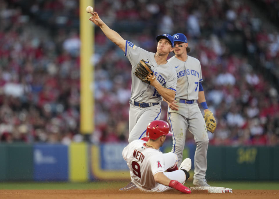 Kansas City Royals second baseman Matt Duffy (15) throws to first after putting Los Angeles Angels' Zach Neto (9) at second during the fifth inning of a baseball game against the Kansas City Royals in Anaheim, Calif., Saturday, April 22, 2023. Luis Rengifo was safe at first. (AP Photo/Ashley Landis)