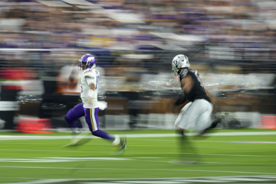 Minnesota Vikings quarterback Joshua Dobbs (15) runs the ball against the Las Vegas Raiders during the second half of an NFL football game, Sunday, Dec. 10, 2023, in Las Vegas. (AP Photo/John Locher)