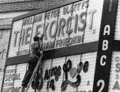 <p>A theater worker puts up the marquee letters for the 1973 premiere of <em>The Exorcist</em>. The film was the first horror movie ever to earn a Best Picture nomination at the Academy Awards.</p>