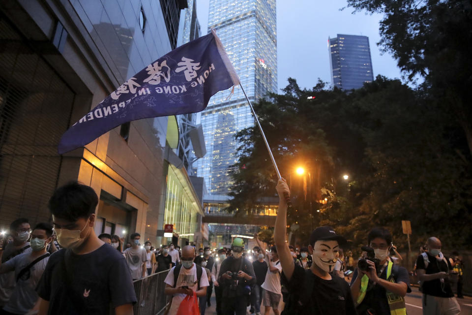 Pro-democracy demonstrators show a banner reading "Hong Kong Independence" during a protest to mark the first anniversary of a mass rally against the now-withdrawn extradition bill in Hong Kong, Tuesday, June 9, 2020. One year ago, a sea of humanity a million people by some estimates marched through central Hong Kong on a steamy afternoon. It was the start of what would grow into the longest-lasting and most violent anti-government movement the city has seen since its return to China in 1997. (AP Photo/Kin Cheung)