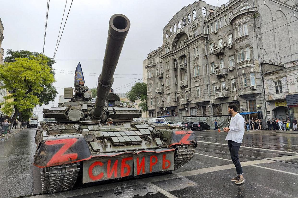 Servicemen in a tank with a flag of the Wagner Group military company in Rostov-on-Don, Russia. 