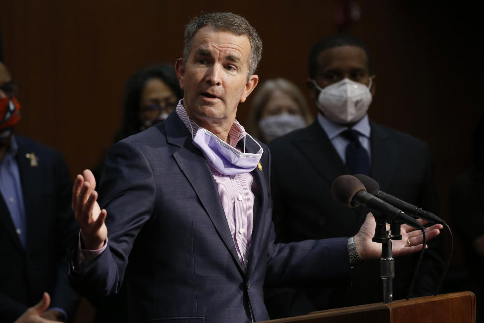 Virginia Gov. Ralph Northam gestures as he announces his plans to remove the statue of Confederate General Robert E. Lee on Monument Avenue during a news conference Thursday, June 4, 2020, in Richmond, Va. (AP Photo/Steve Helber)