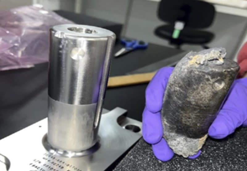 This undated photo provided by NASA shows a recovered chunk of space junk from equipment discarded at the International Space Station. The cylindrical object that tore through a home in Naples, Fla., March 8, 2024, was subsequently taken to the Kennedy Space Center in Cape Canaveral, Fla., for analysis. (NASA via AP)