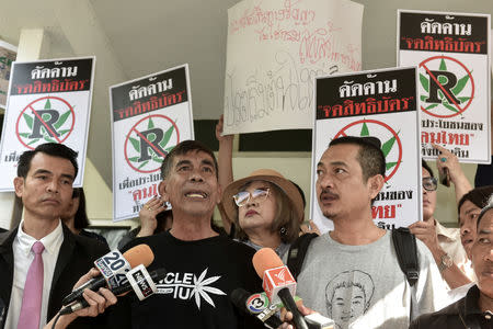 Thai activists who use marijuana therapy hold placards as they gather during a campaign for the legalisation of medical marijuana near Government House in Bangkok, Thailand, November 20, 2018. REUTERS/Panumas Sanguanwong/Files