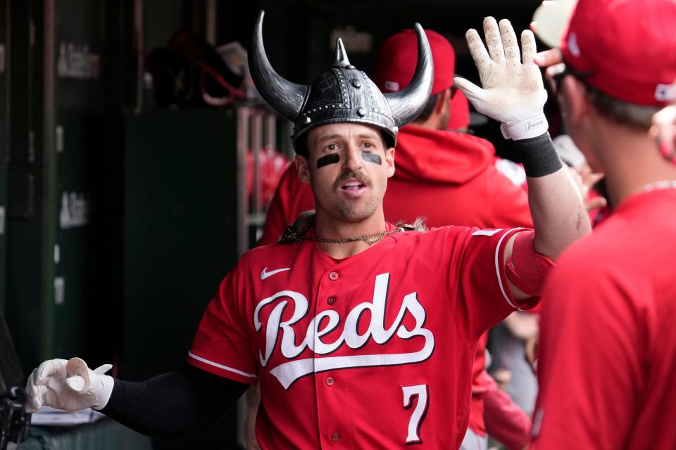 Cincinnati Reds' Spencer Steer celebrates with teammates after hitting a two-run home run during the sixth inning of a baseball game against the Chicago Cubs in Chicago, Sunday, May 28, 2023.