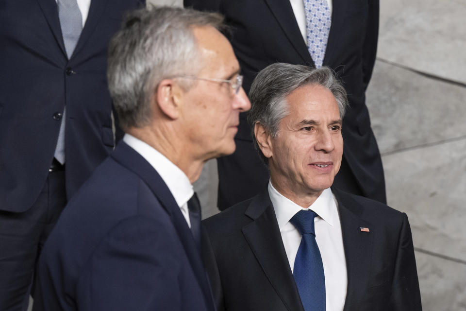 NATO Secretary General Jens Stoltenberg, left, and US Secretary of State Antony Blinken, right, line up for a family photo during the NATO Foreign Ministers meeting at the NATO Headquarters in Brussels, Belgium, Tuesday, Nov. 28, 2023. (Saul Loeb/Pool Photo via AP)