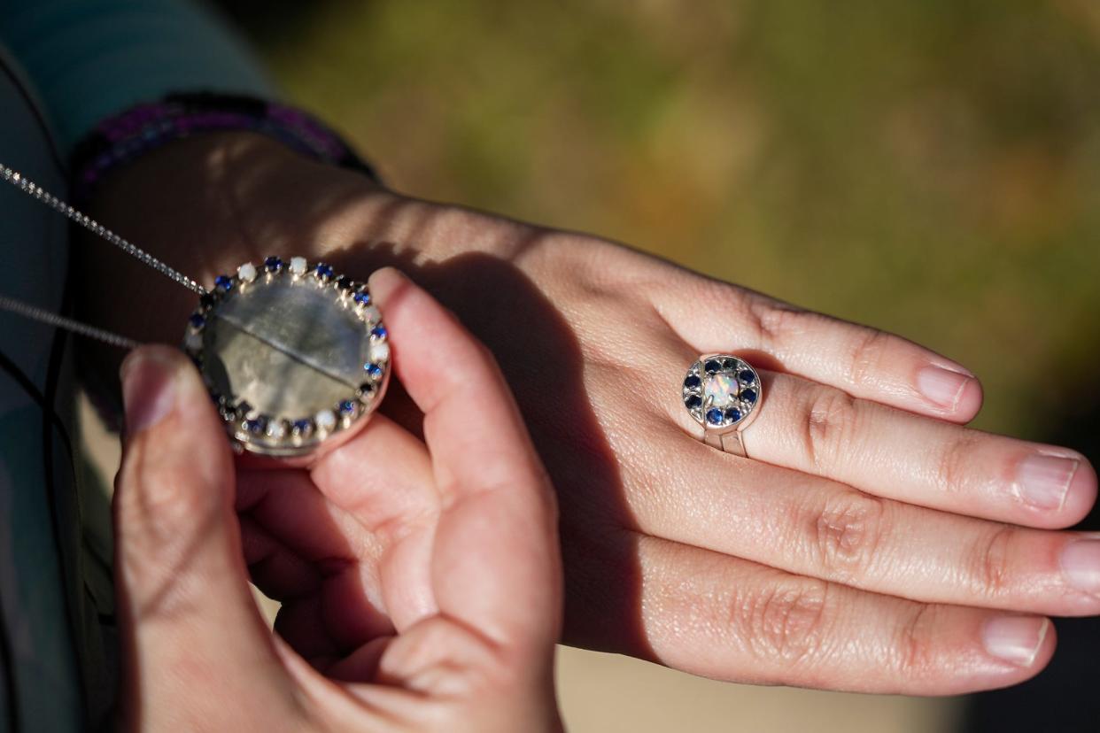 A locket containing the hair of her husband, John, is displayed by K. Lynn Samerigo in addition to her wedding ring.