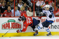 WASHINGTON, DC - FEBRUARY 09: Andrew Ladd #16 of the Winnipeg Jets collides with Matt Hendricks #26 of the Washington Capitals at the Verizon Center on February 9, 2012 in Washington, DC. (Photo by Greg Fiume/Getty Images)