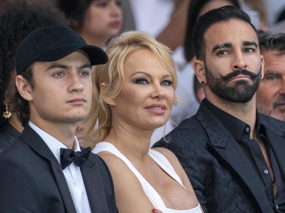 MONTE-CARLO, MONACO - MAY 24: (L-R) Brandon Thomas Lee, Pamela Anderson and Adil Rami attend Amber Lounge 2019 Fashion Show on May 24, 2019 in Monte-Carlo, Monaco. (Photo by Arnold Jerocki/Getty Images)