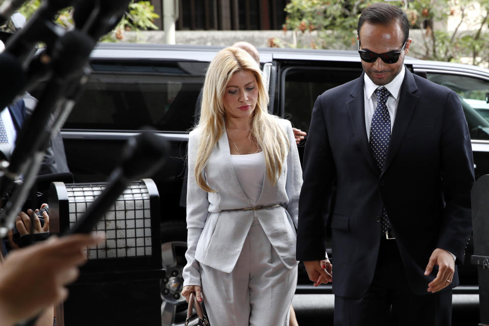 Former Donald Trump presidential campaign foreign policy adviser George Papadopoulos, right, who pleaded guilty to one count of making false statements to the FBI during the agency's Russia probe, holds hands with his wife Simona Mangiante, as they arrive at federal court for sentencing, Friday, Sept. 7, 2018, in Washington. (AP Photo/Jacquelyn Martin)