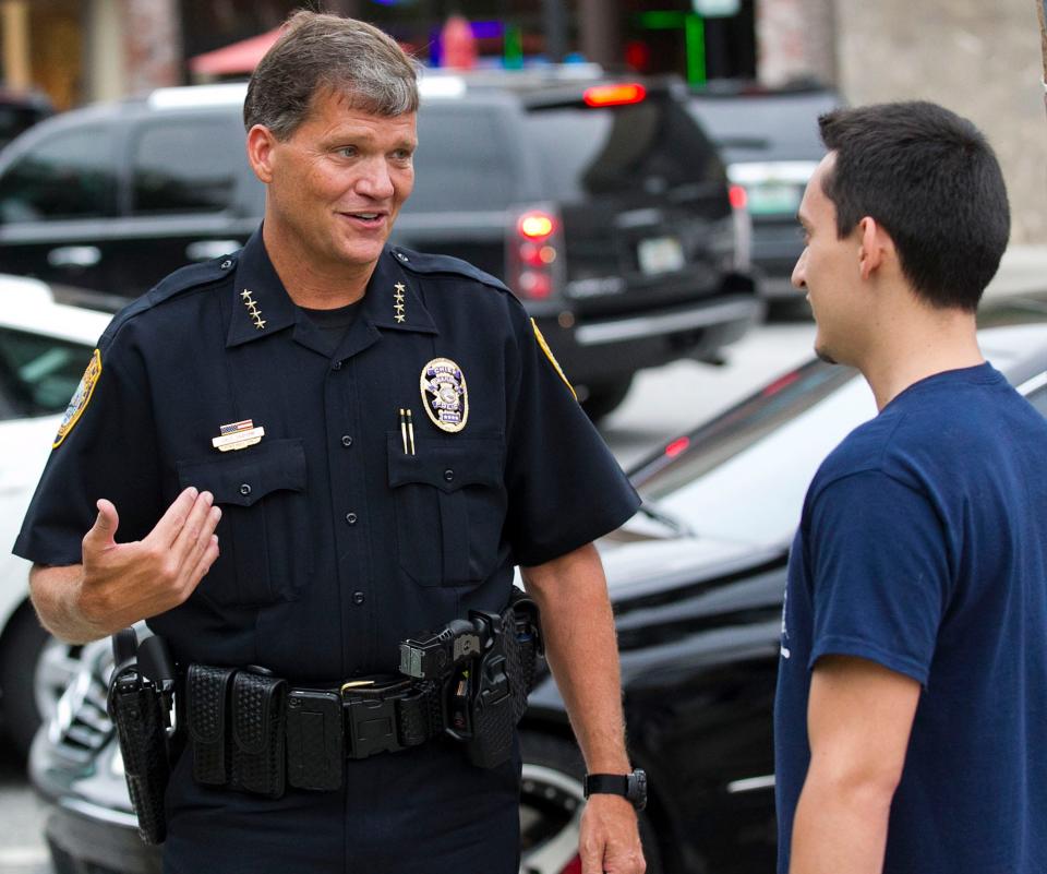 Ocala Chief of Police Greg Graham talks with Art Rojas on Sept. 24, 2014, during a prayer vigil on the Ocala Downtown Square. Rojas and others later filed a federal lawsuit alleging a violation of church and state.