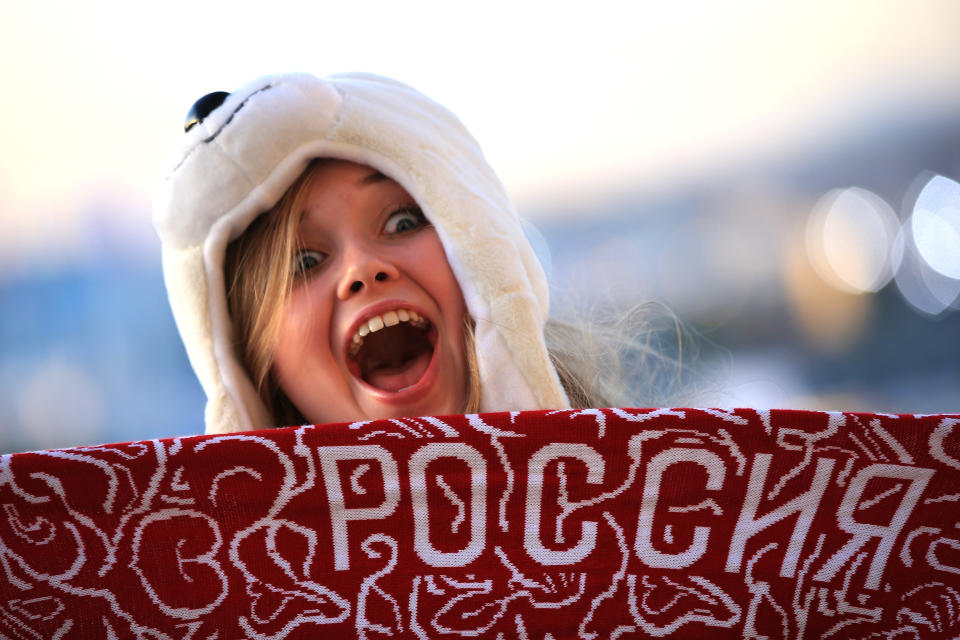 A spectator poses as she arrives for the Opening Ceremony of the Sochi 2014 Winter Olympics at Fisht Olympic Stadium on February 7, 2014 in Sochi, Russia. 